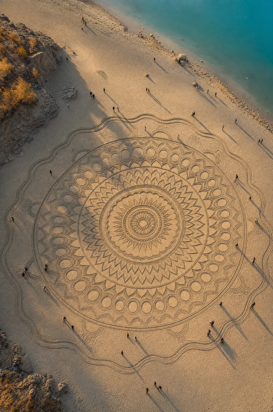 Giant beach sand drawing from above